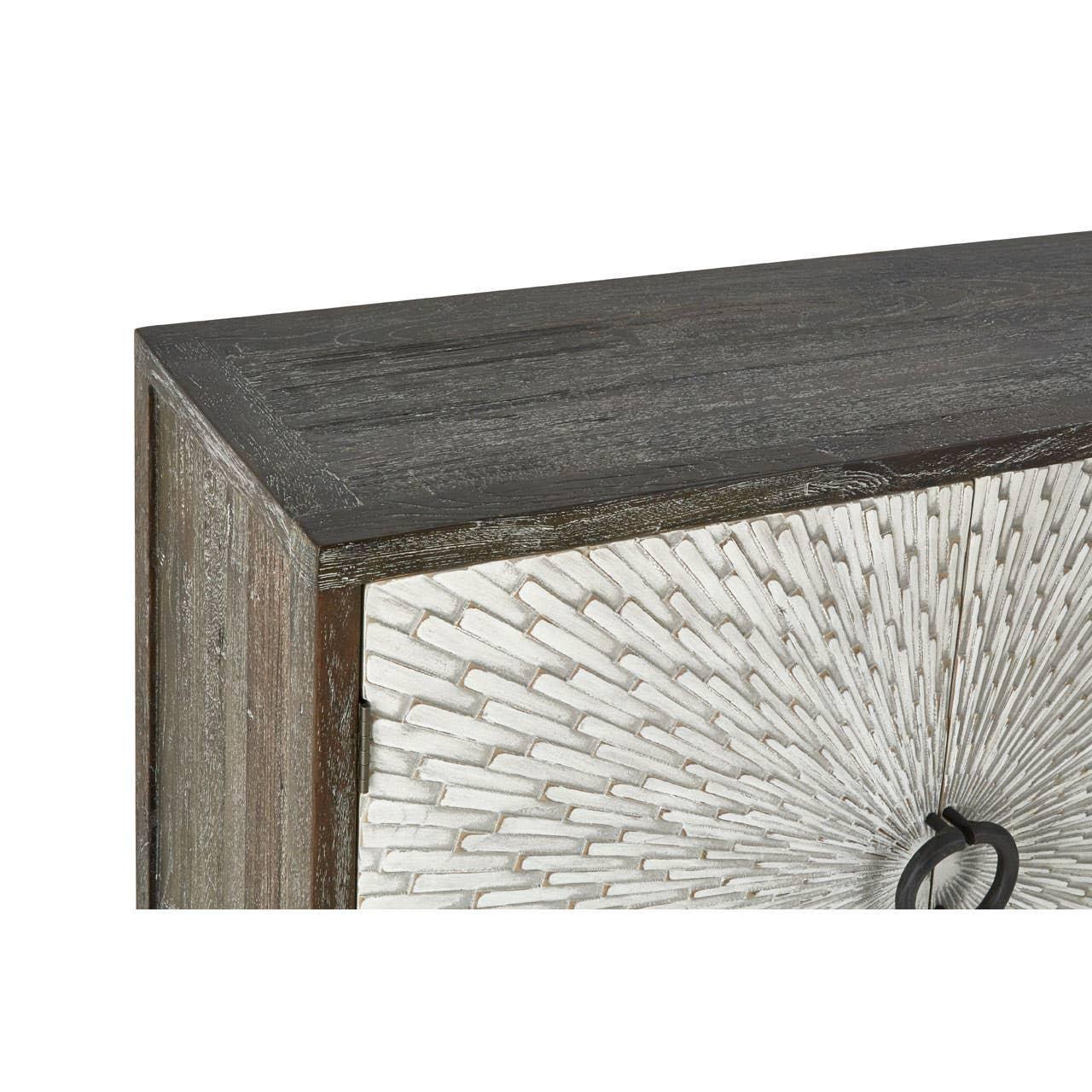 Wood sideboard corner with textured white sunburst door and black circular handle