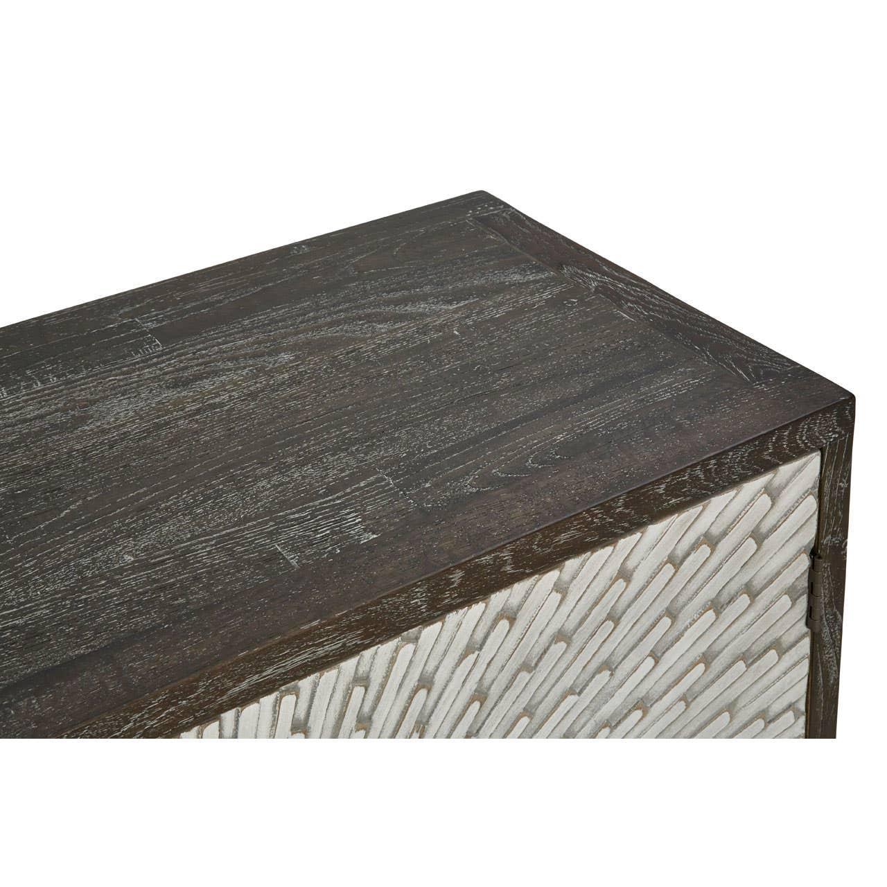 Dark wood cabinet with textured chevron front panel, close up on corner and surface