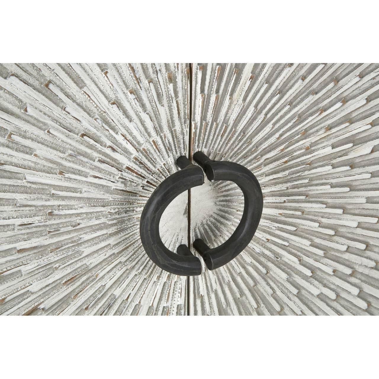 Textured wood cabinet doors with black circular metal handles and sunburst pattern