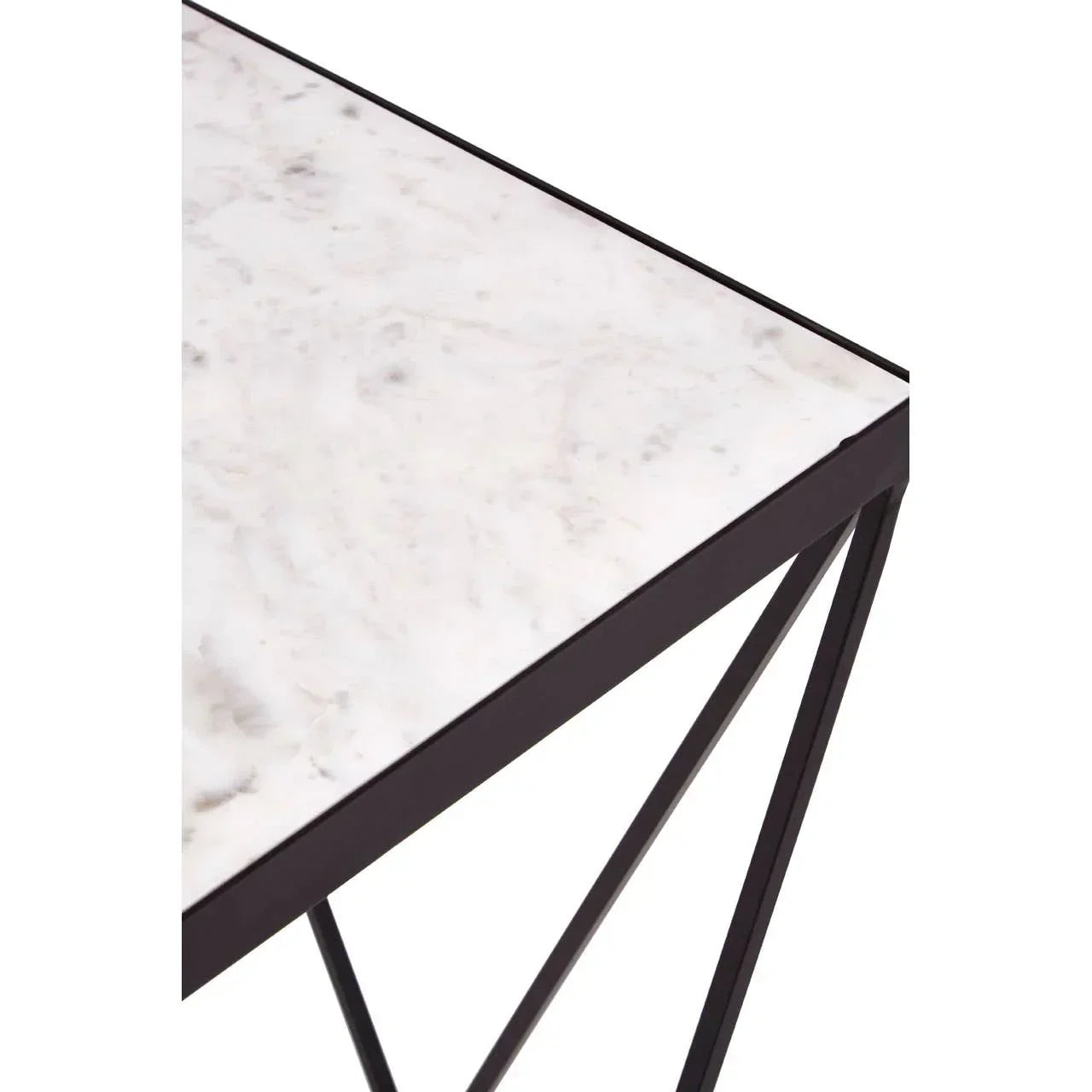 White marble top table with black metal legs, close-up of corner and frame design