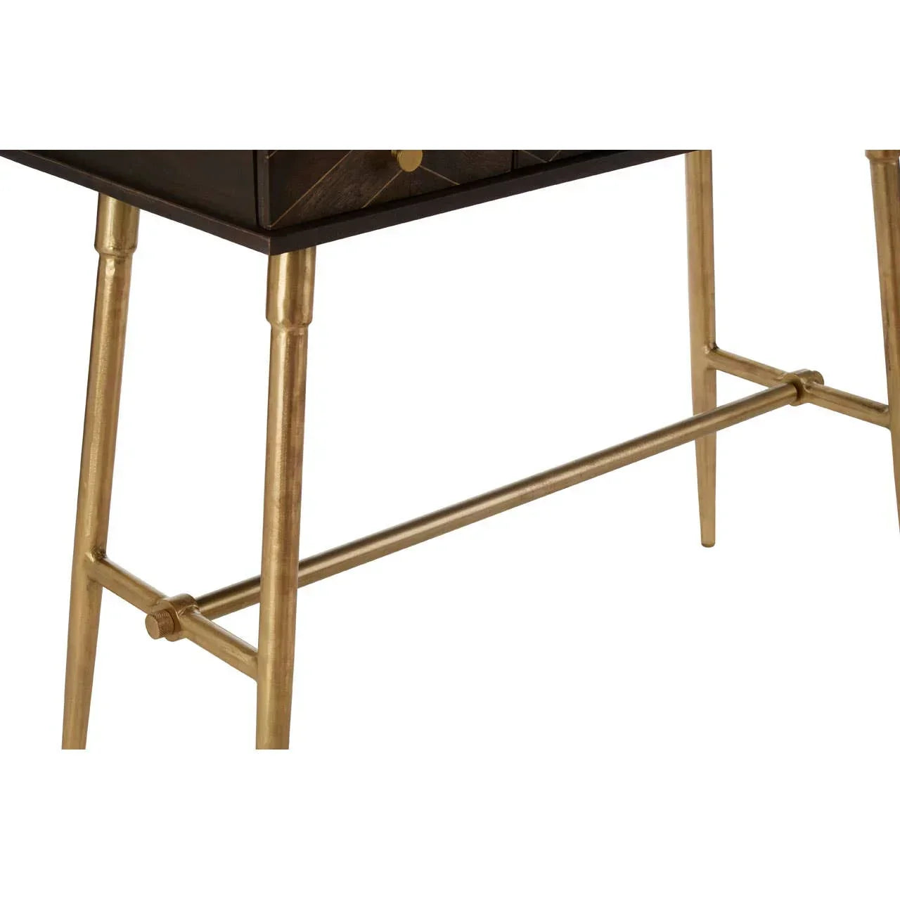 Close-up of metal console table legs in gold finish with crossbar support