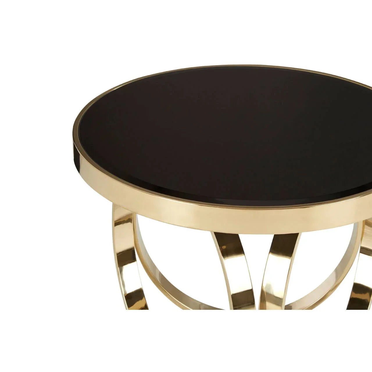 Round black glass coffee table with gold metal frame and curved legs, close-up view