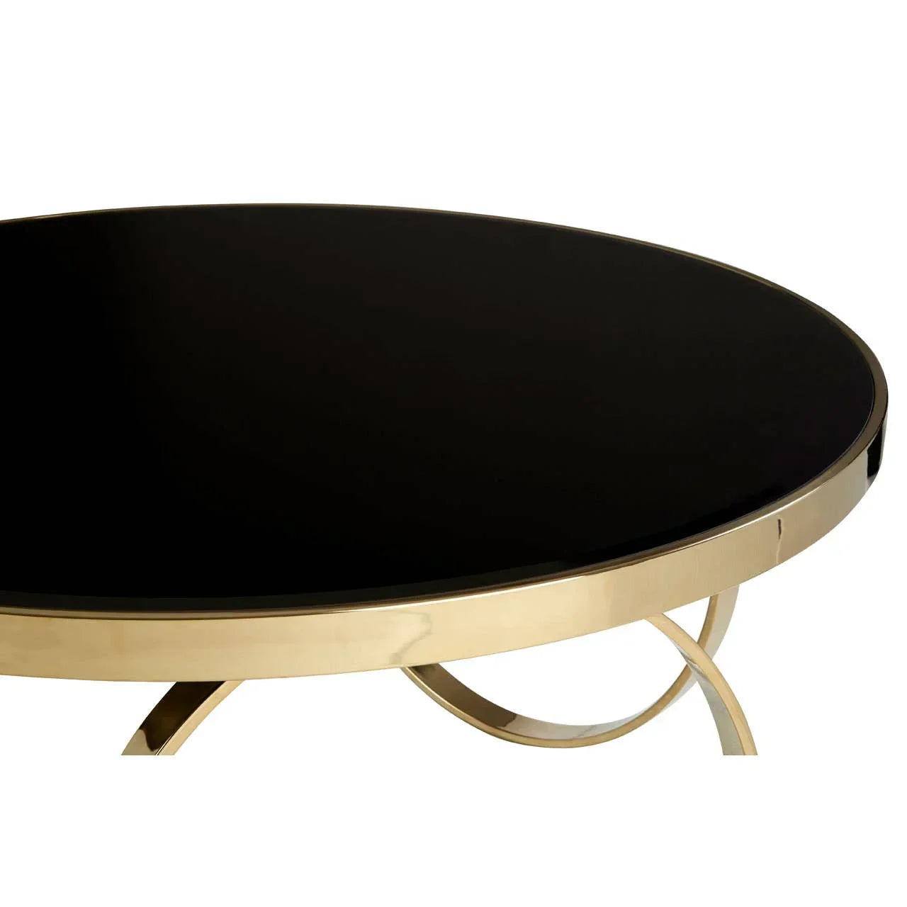 Round black glass coffee table with gold metal frame, side angle view