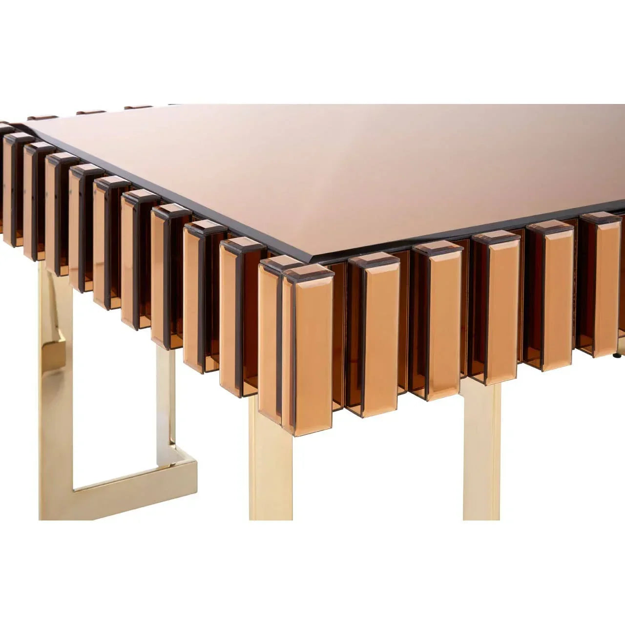 Modern glass dining table with gold geometric legs and amber acrylic edge detail