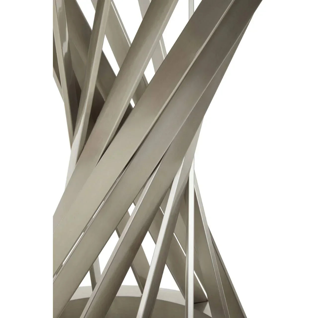 Close view of metal dining table base with interlaced brushed steel slats