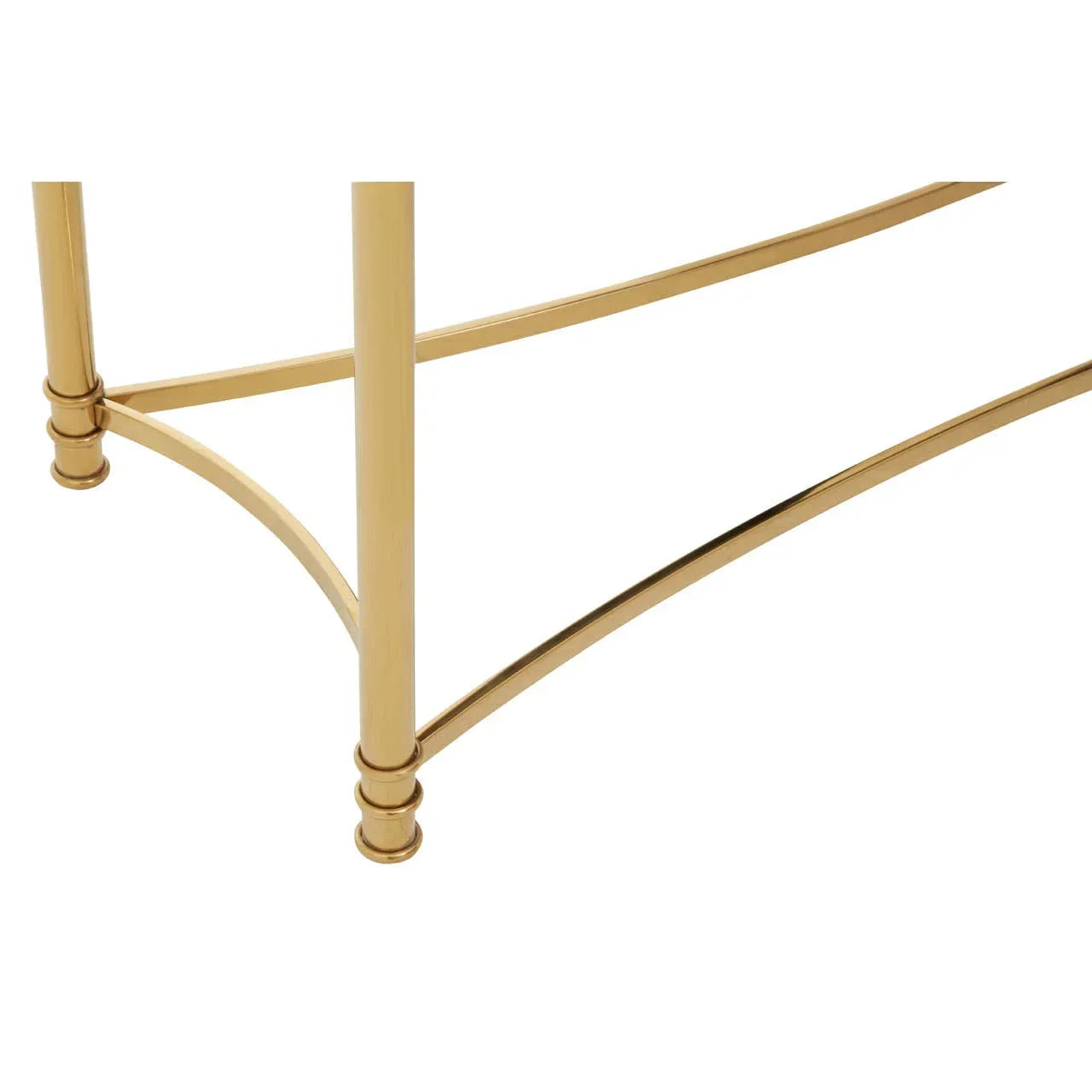Gold metal table legs with curved crossbar detail, close-up furniture feature view