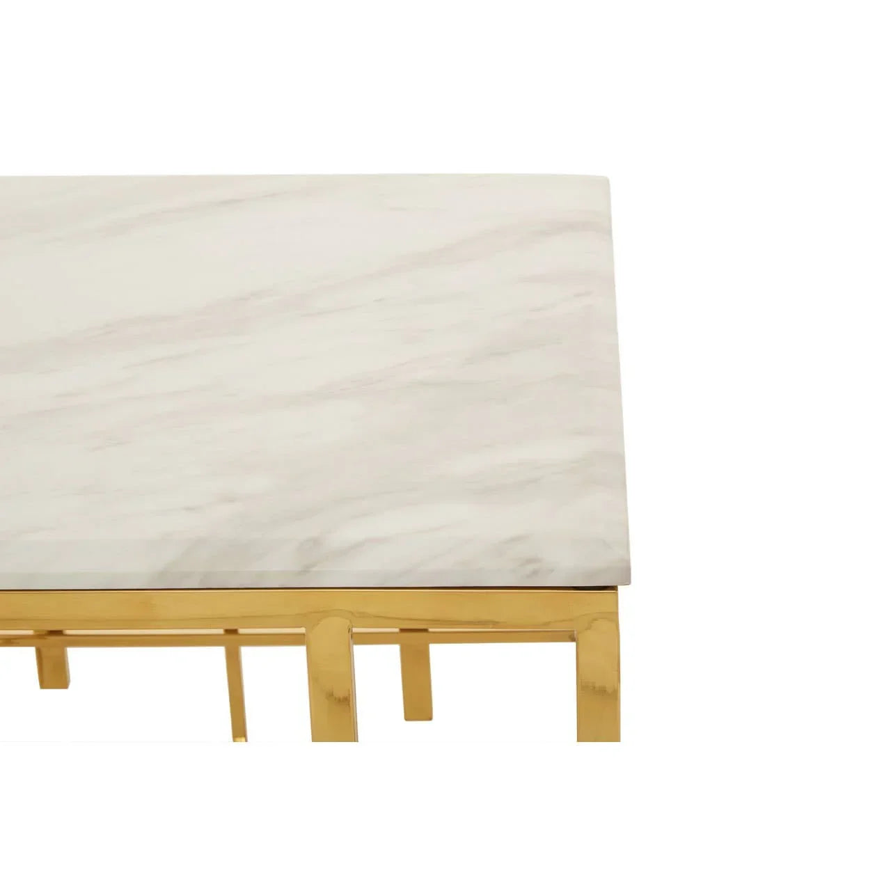 White marble table top with gold metal legs, close-up corner view