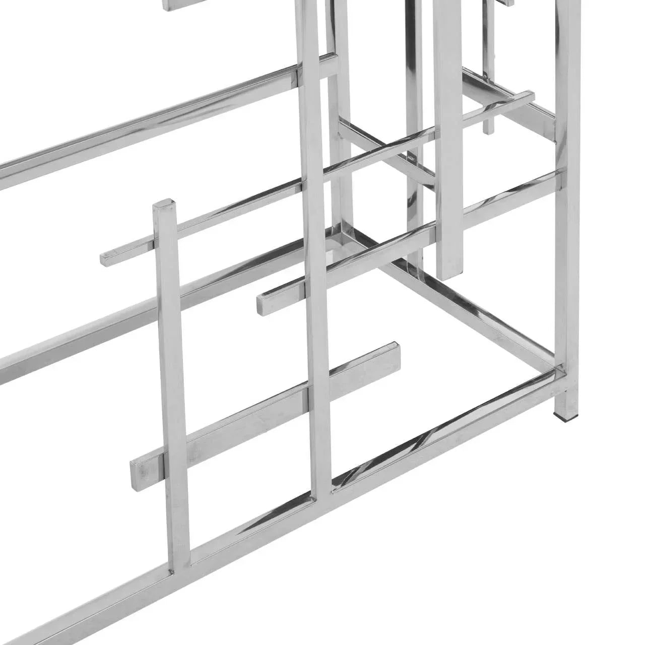 Close-up of metal console table base with geometric chrome frame design