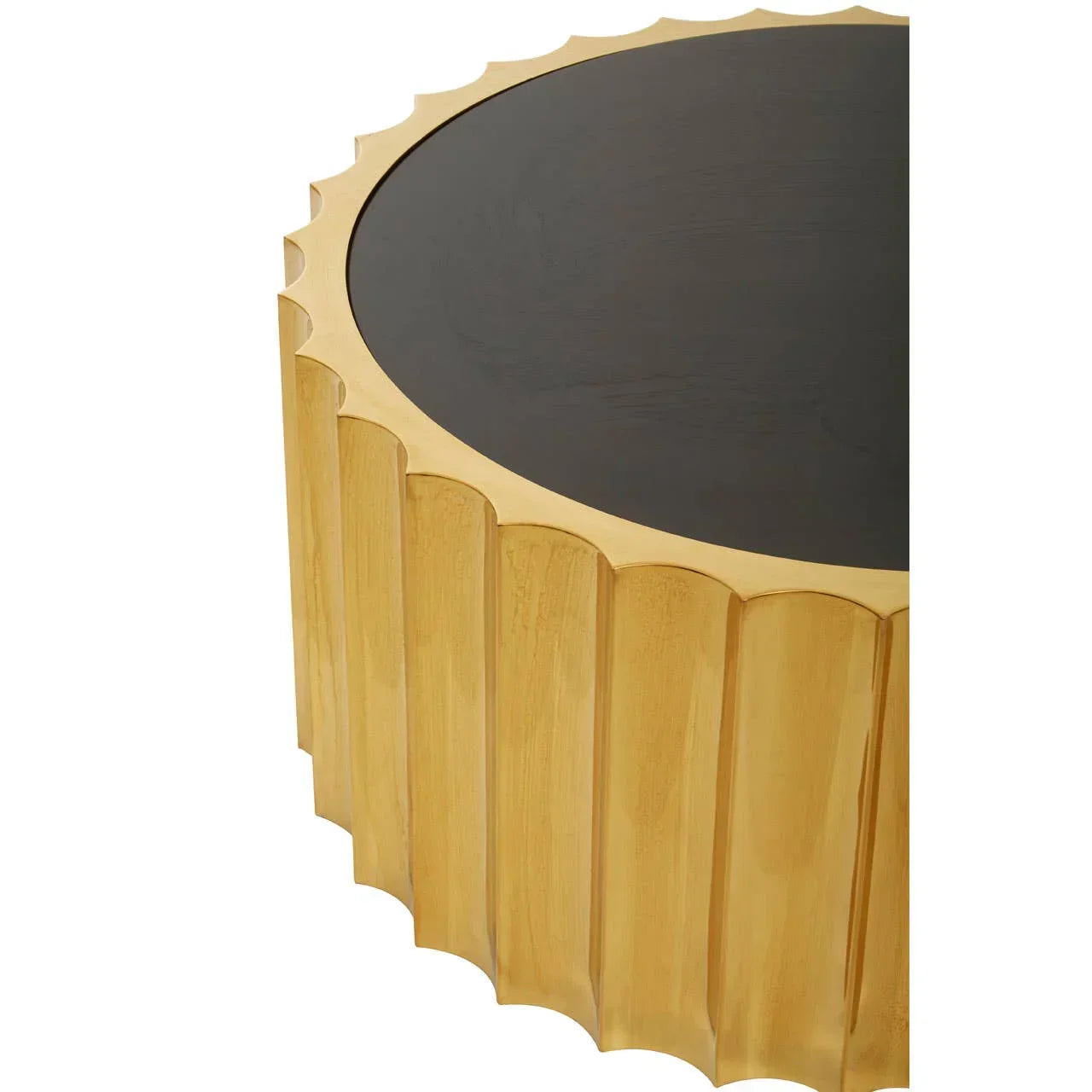Round gold coffee table with scalloped sides and black wooden top, close-up angle