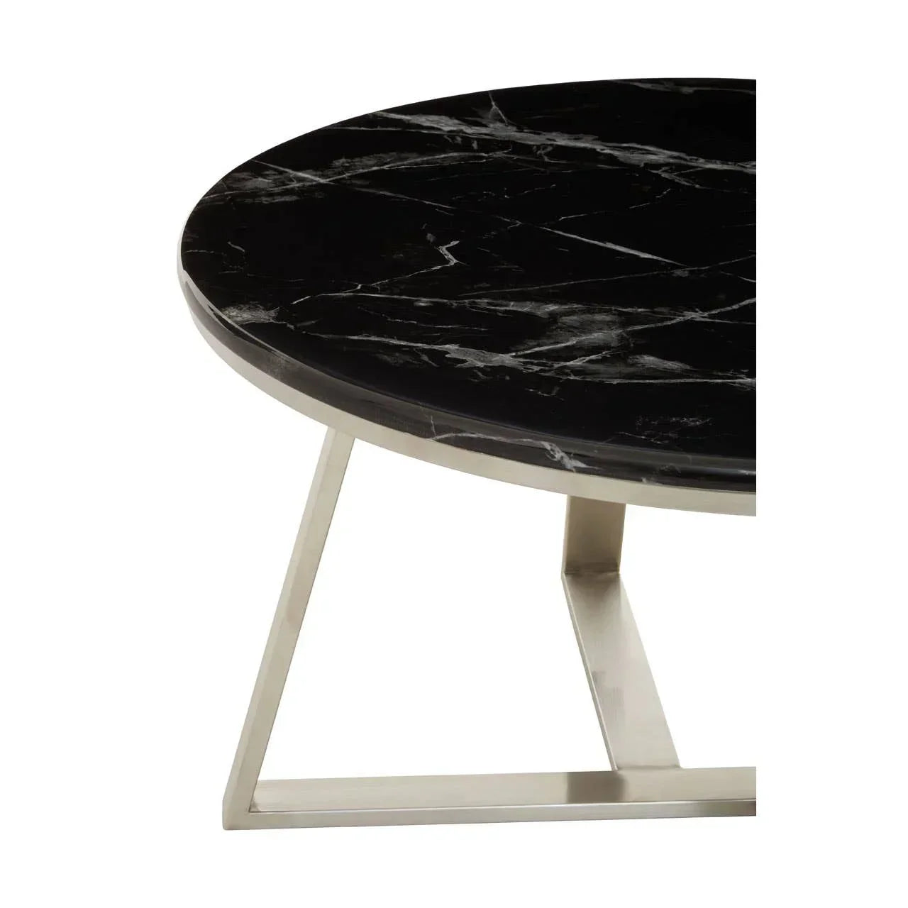 Round black marble coffee table with silver metal frame, close-up of tabletop and leg