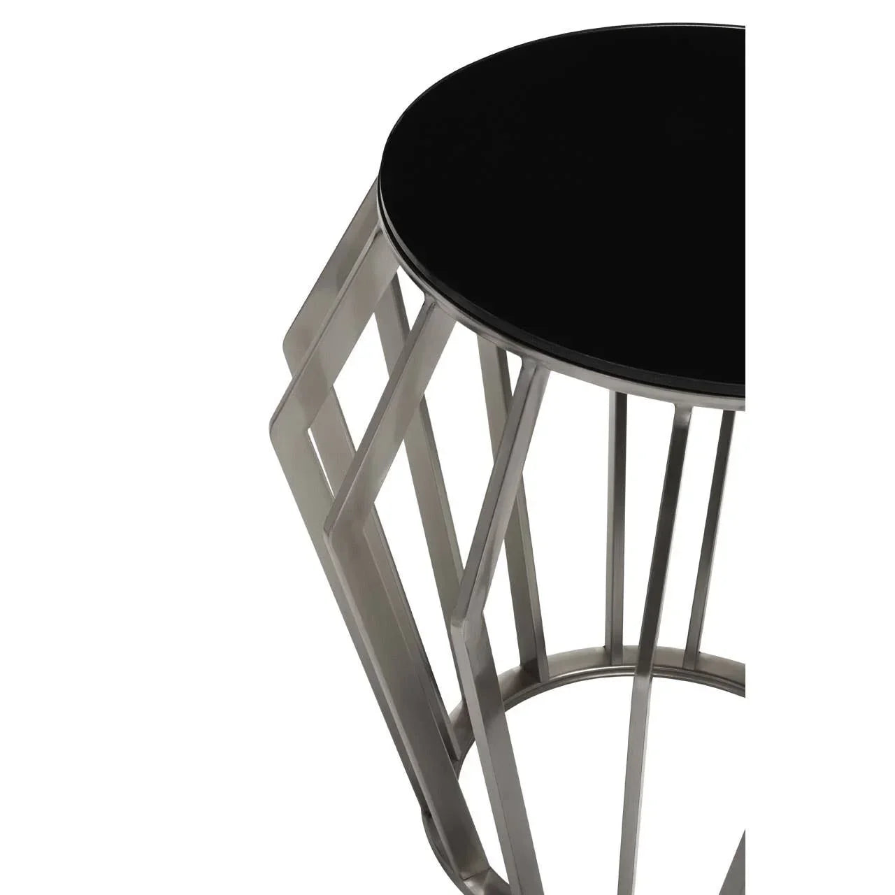 Round black glass top side table with geometric silver metal base, partial close-up view