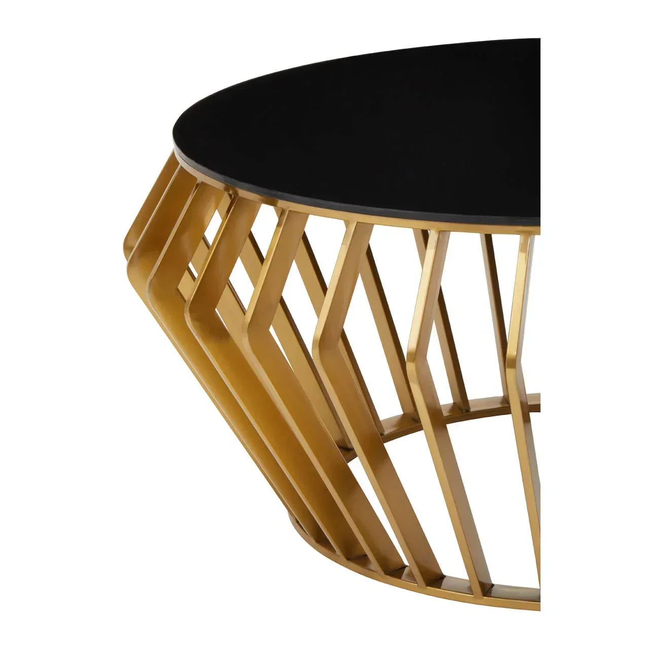 Round black glass coffee table with gold geometric metal base, close-up view