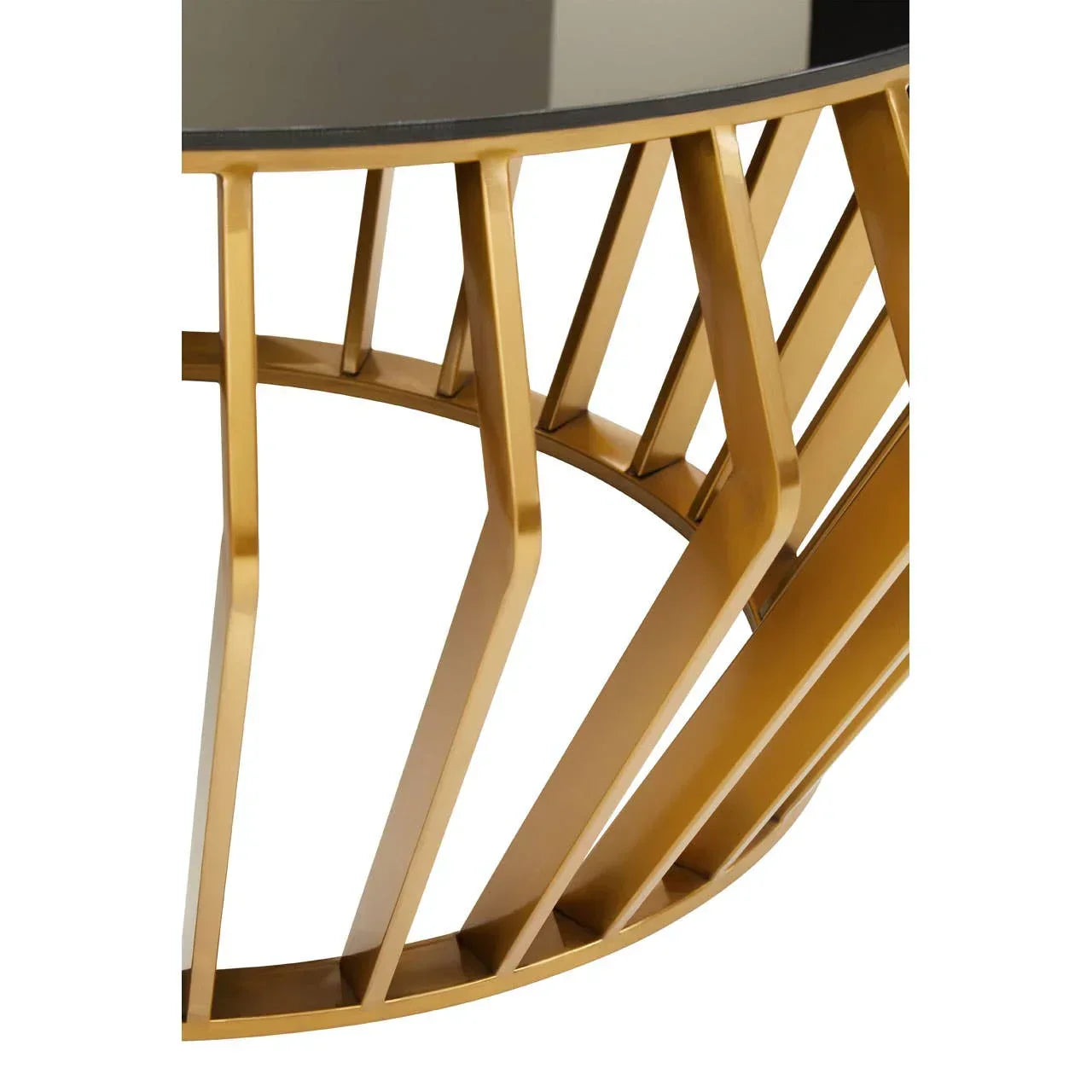 Gold metal coffee table base with geometric design and glass top close up
