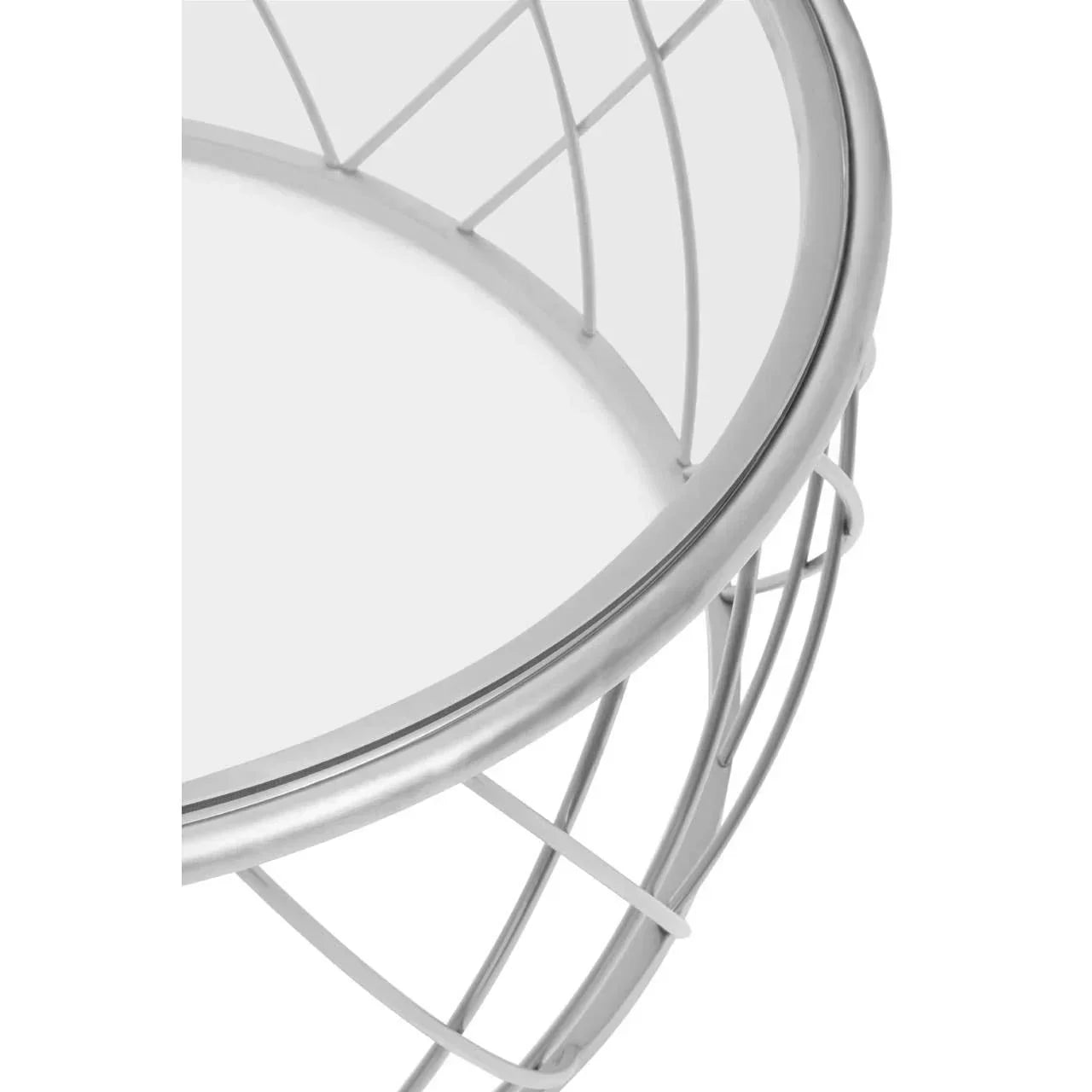 Closeup of round metal wire side table with glass top, silver finish
