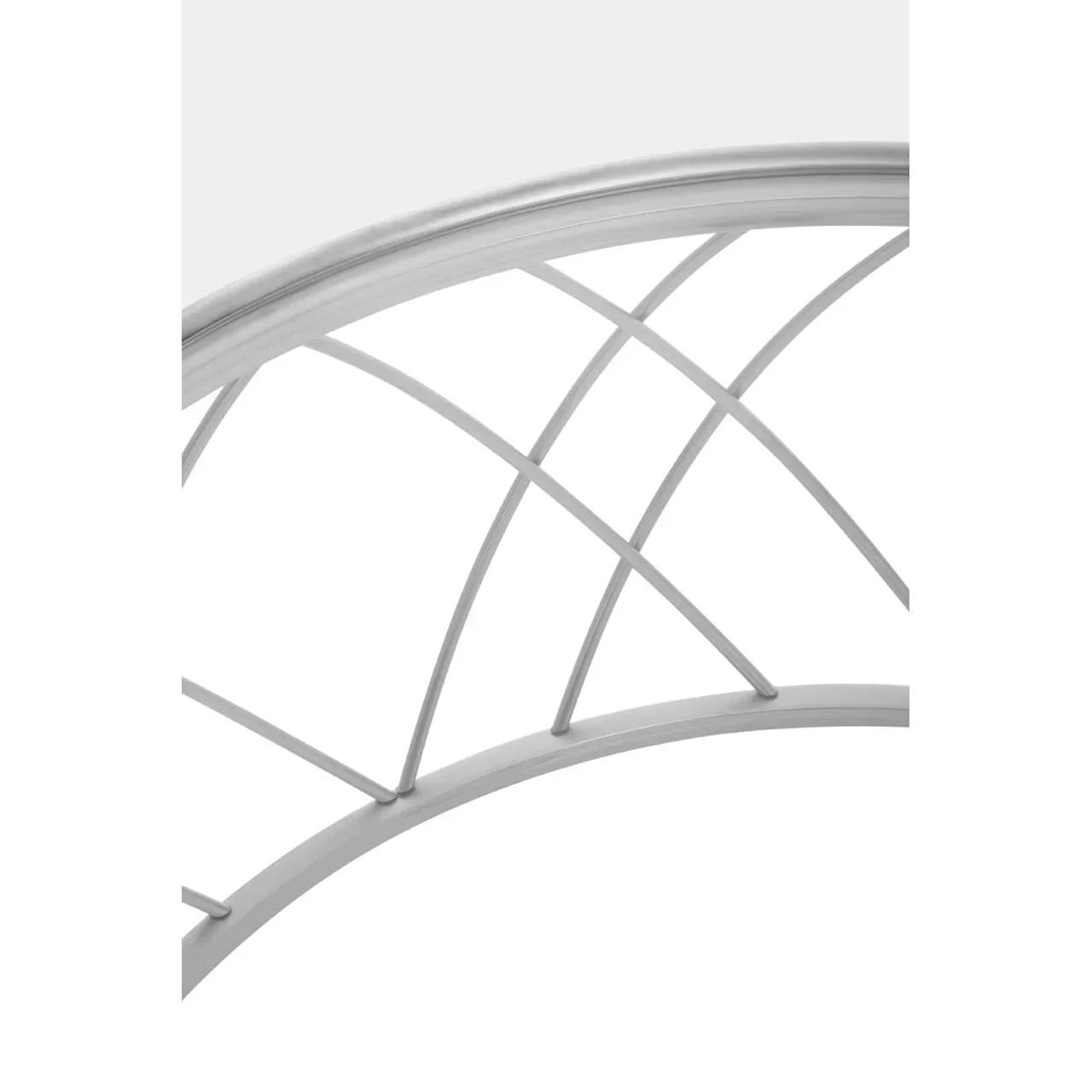 Curved metal bed frame headboard with silver finish and crisscross design close-up