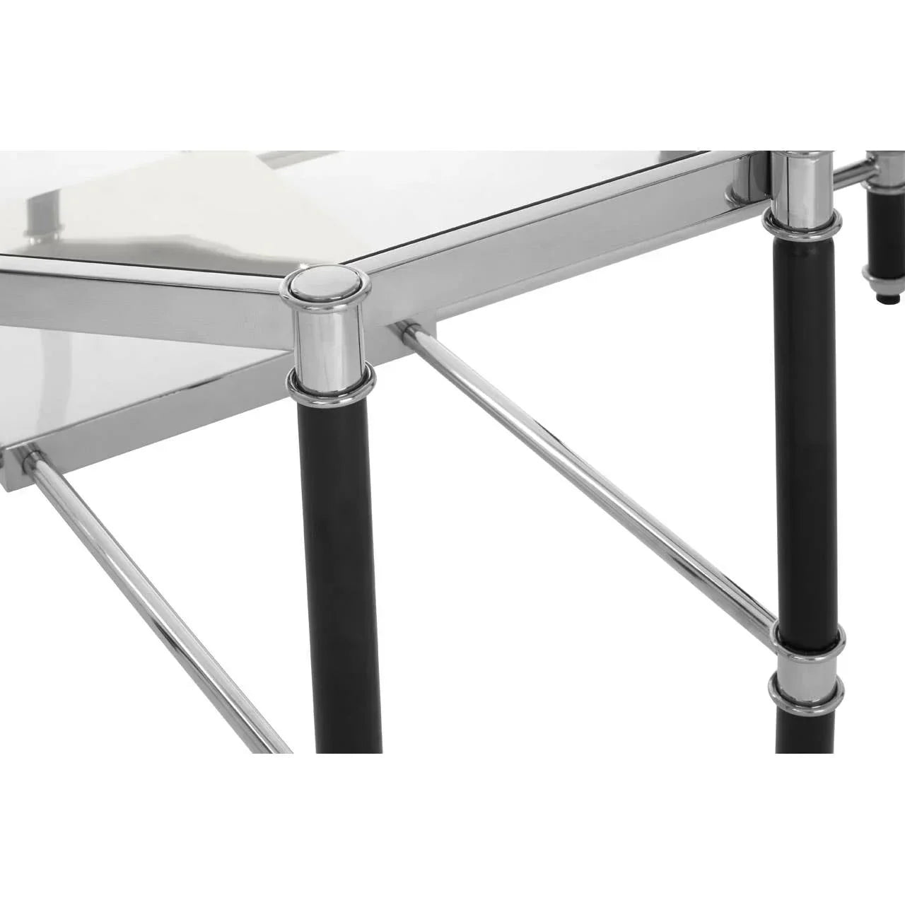 Glass side table with chrome frame and black legs, close-up of corner design