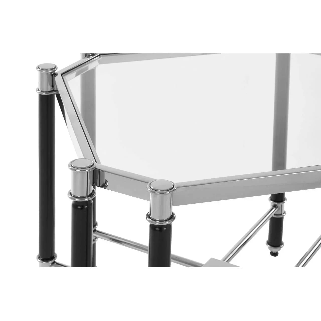 Glass top side table with chrome frame and black legs, close-up of corner detail