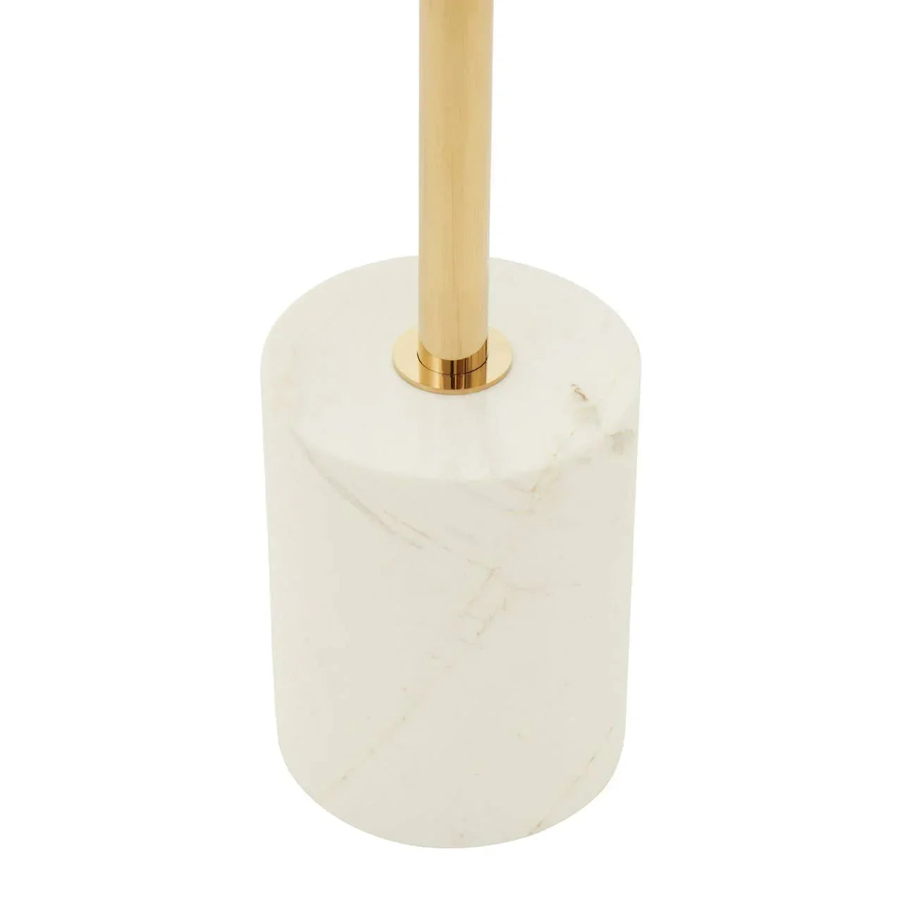 Gold floor lamp with white marble cylindrical base, close-up of base and stand