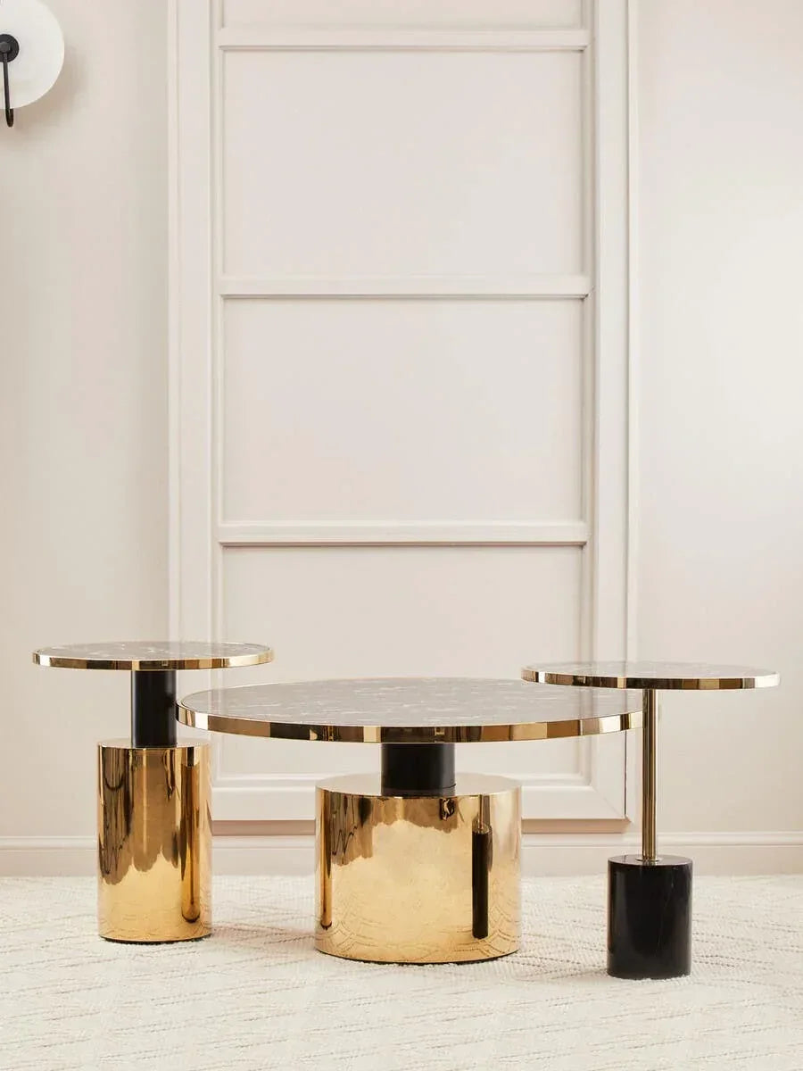 Round marble and gold coffee table set with nested side tables on light rug