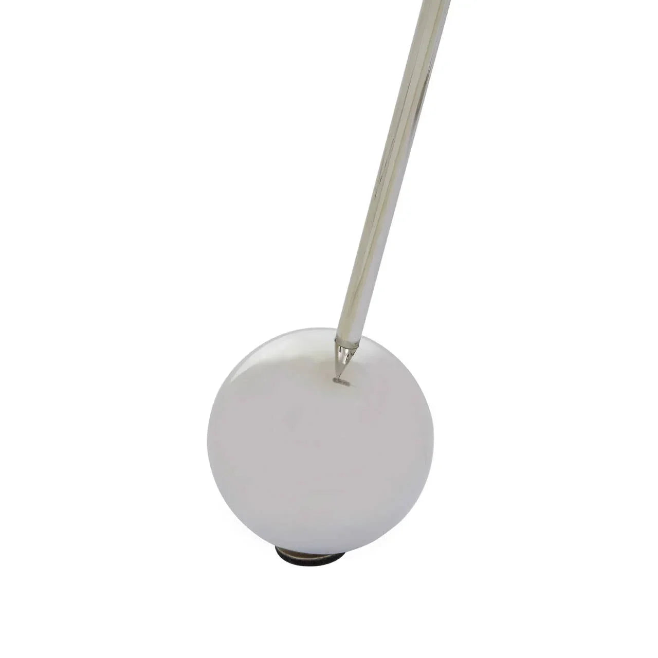 Chrome table lamp leg inserted into round white base on white background
