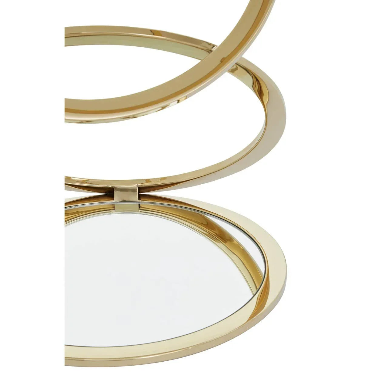 Close-up of round gold metal decorative mirror with hinge detail