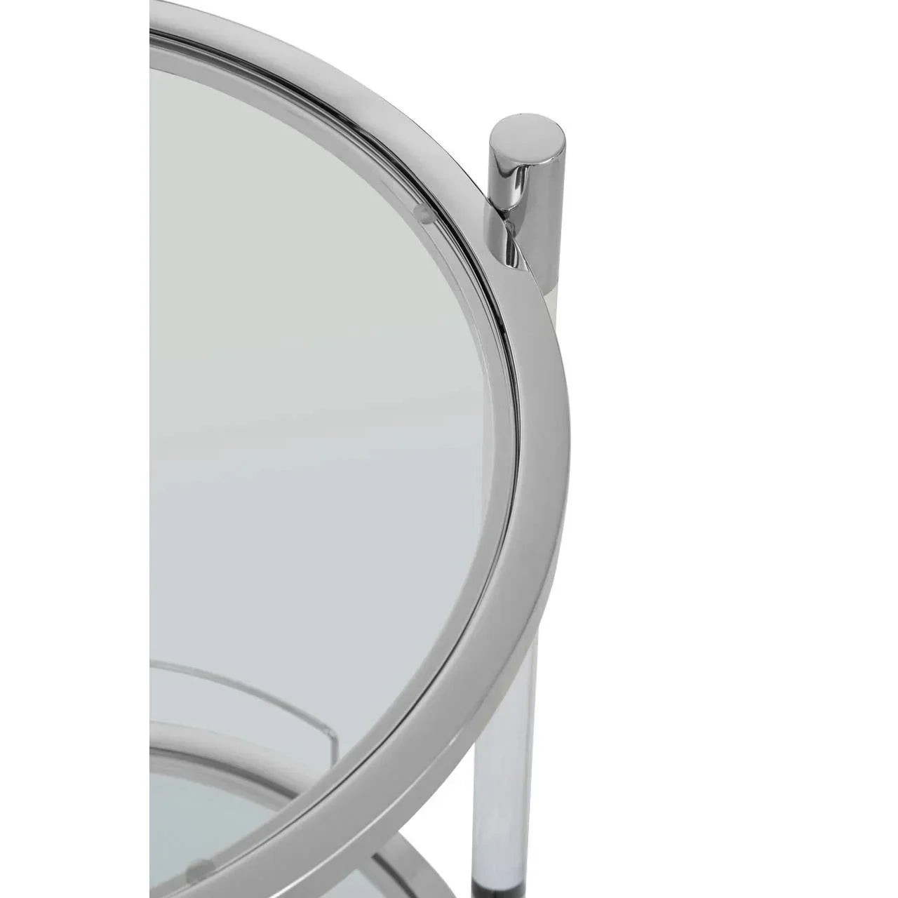 Close up of chrome and glass round side table with modern metal frame detail