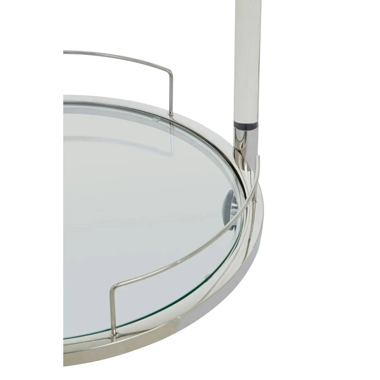 Closeup of round glass side table with chrome frame and raised metal edge