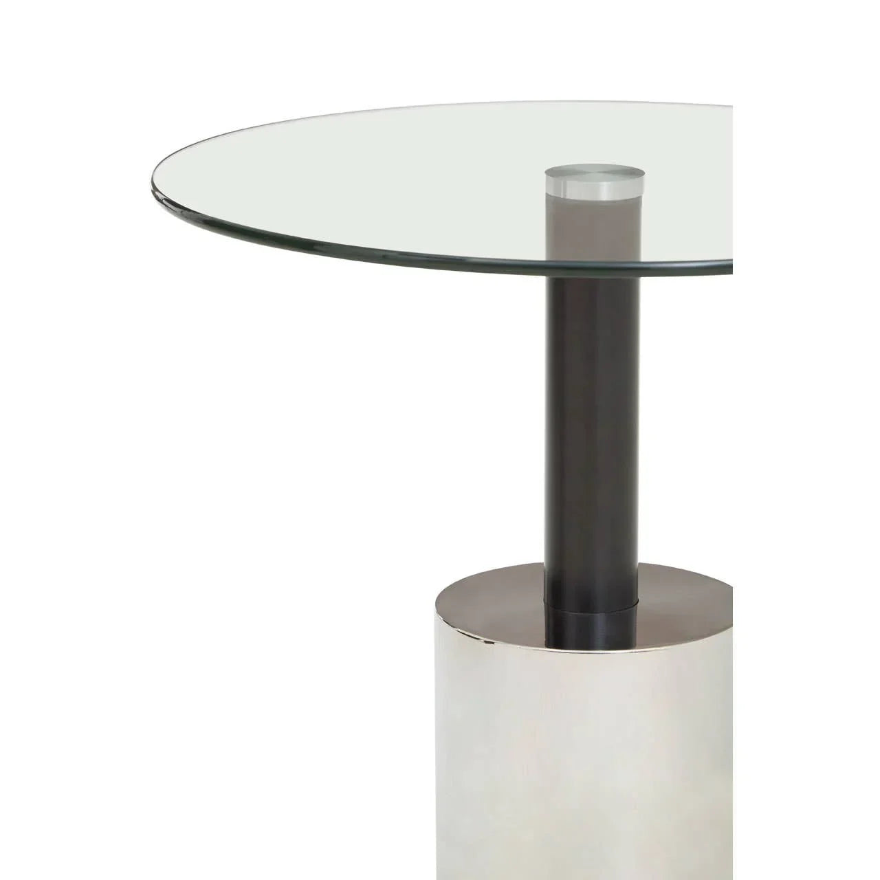 Round glass dining table with metal pedestal base, close-up of tabletop and support