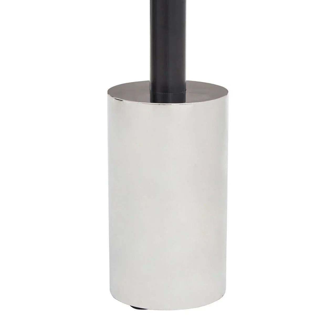 Chrome cylindrical metal lamp base with black pole detail, close-up view