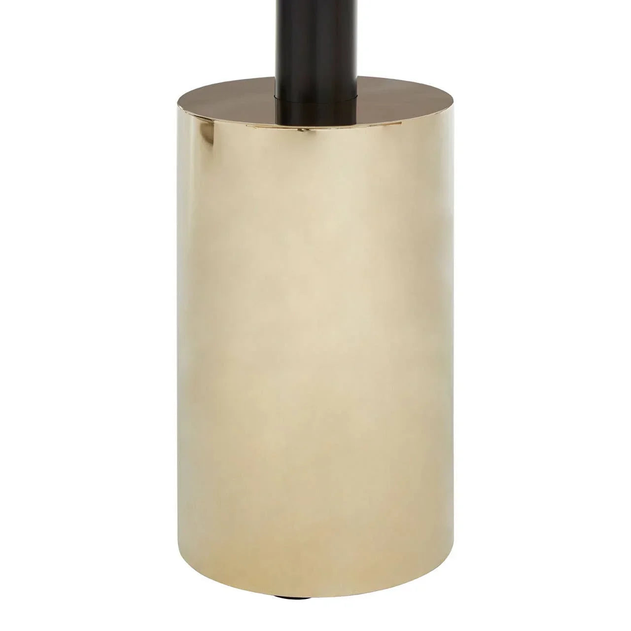 Gold cylindrical metal lamp base with black vertical stem, close-up furniture detail