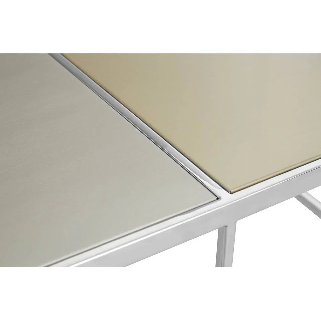 Close-up of metal and glass dining table corner with brushed finish