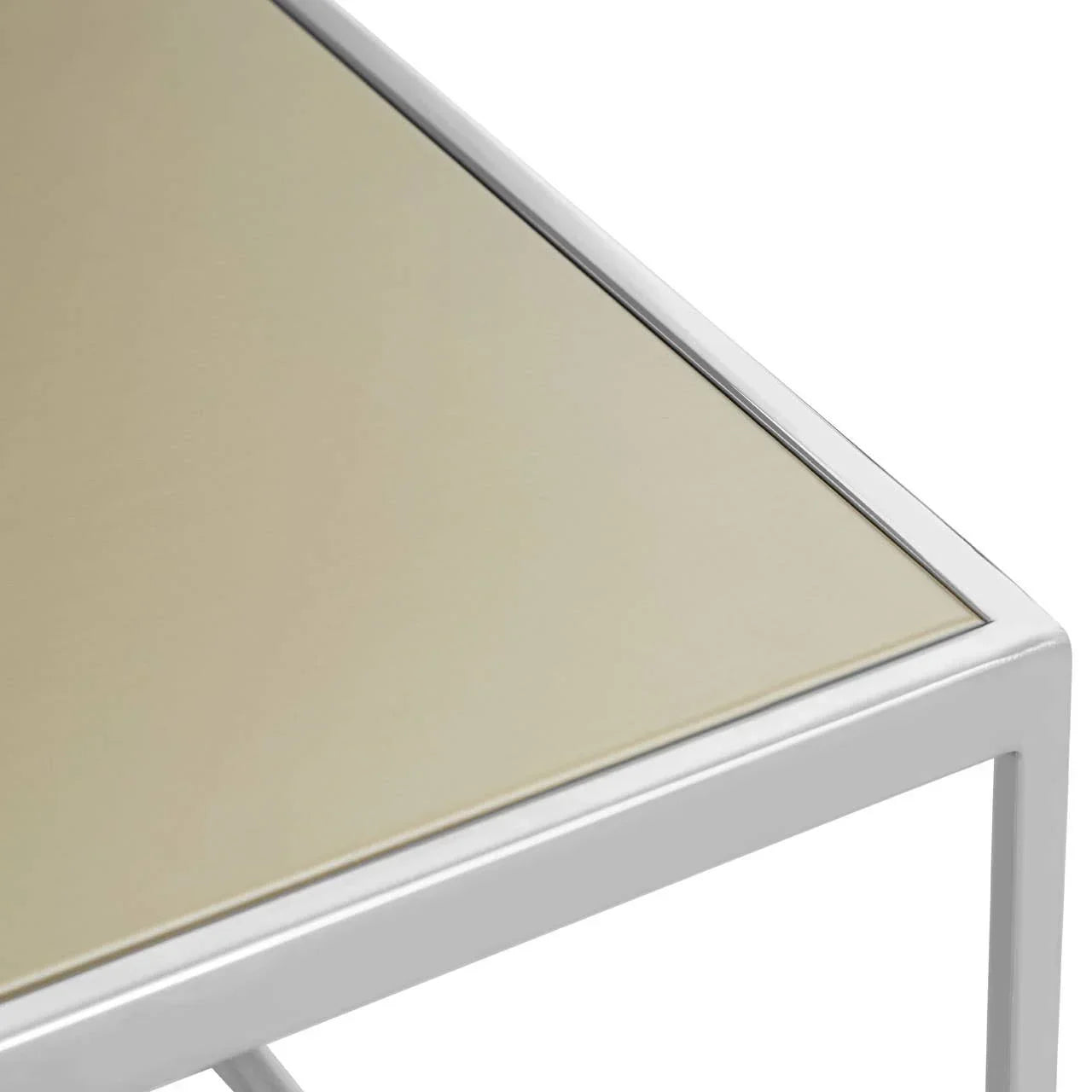 Close view of beige glass top table with white metal frame