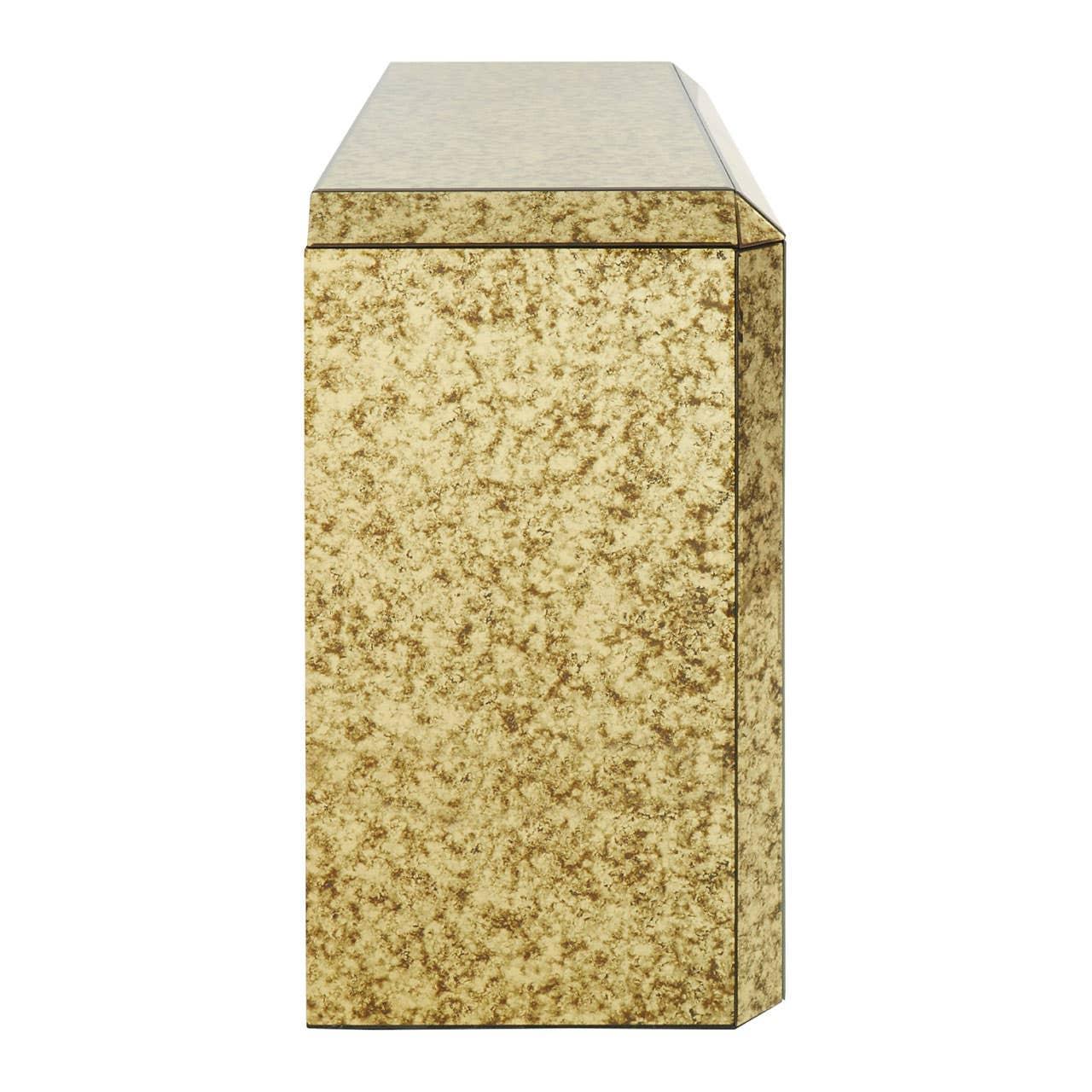 Gold mirrored side table with textured finish, angled corner detail view
