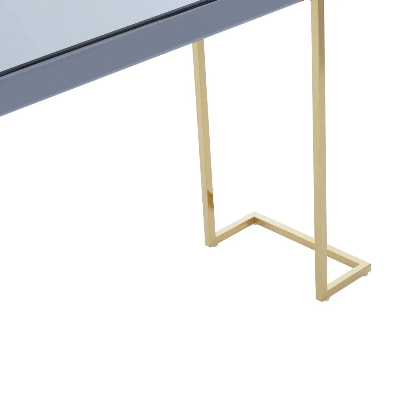 Modern dining table corner with gold metal frame and grey glass top
