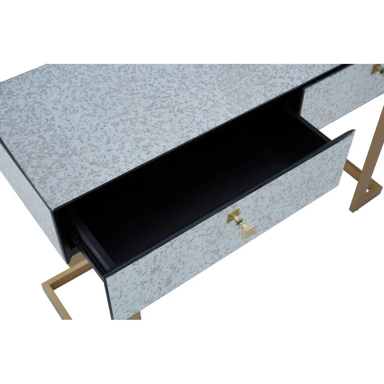 Mirrored console table with gold legs and open drawer, showing modern furniture detail