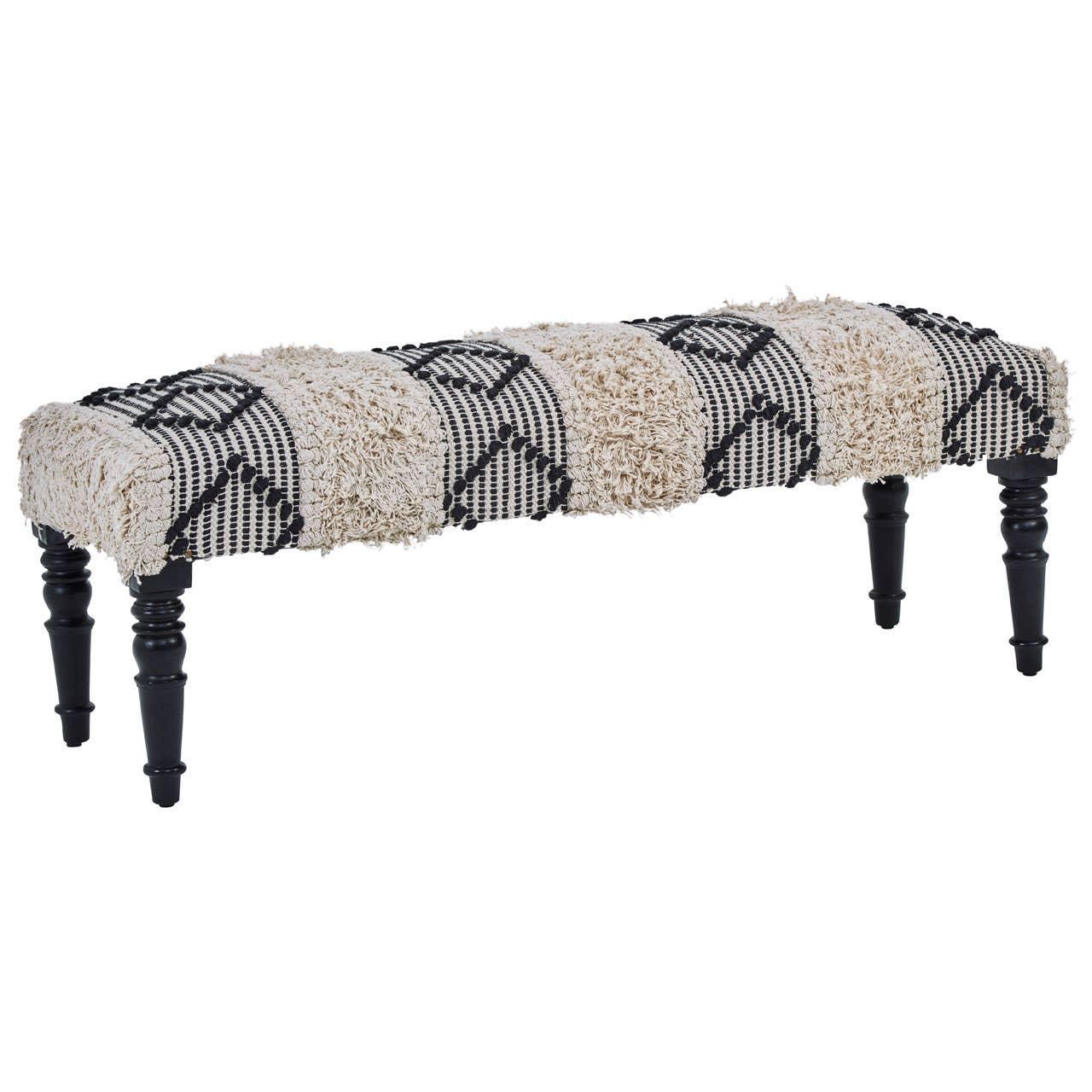 Patterned upholstered bench with textured cream and black fabric and turned wooden legs