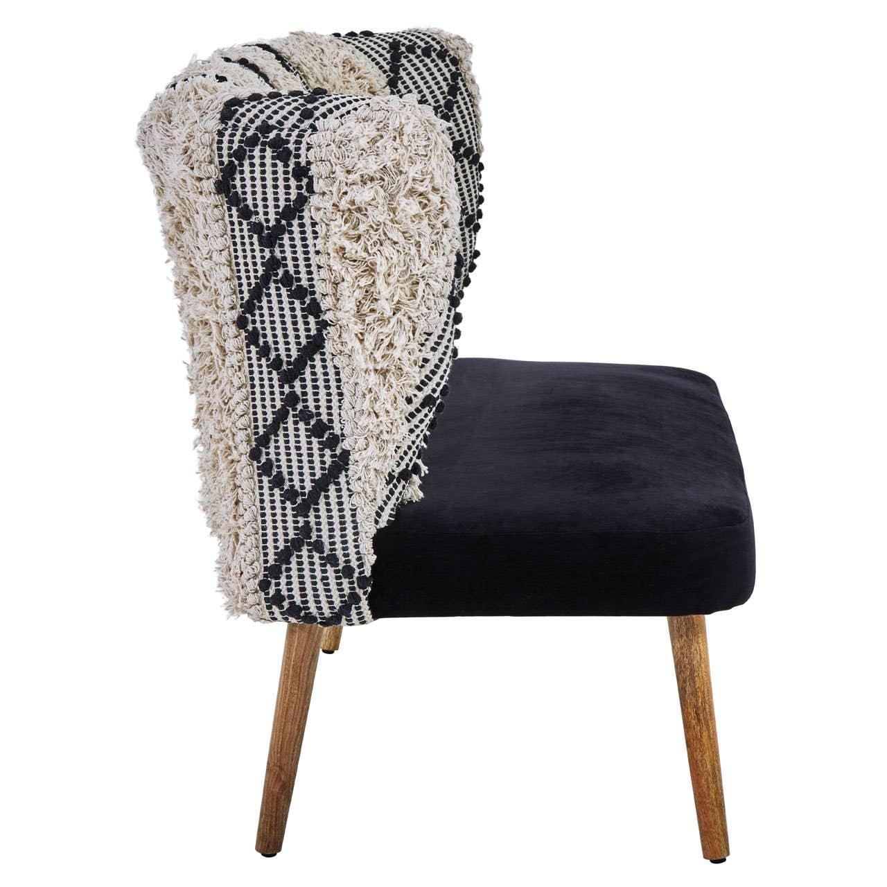 Side view accent chair with black seat, wooden legs, and textured cream patterned backrest