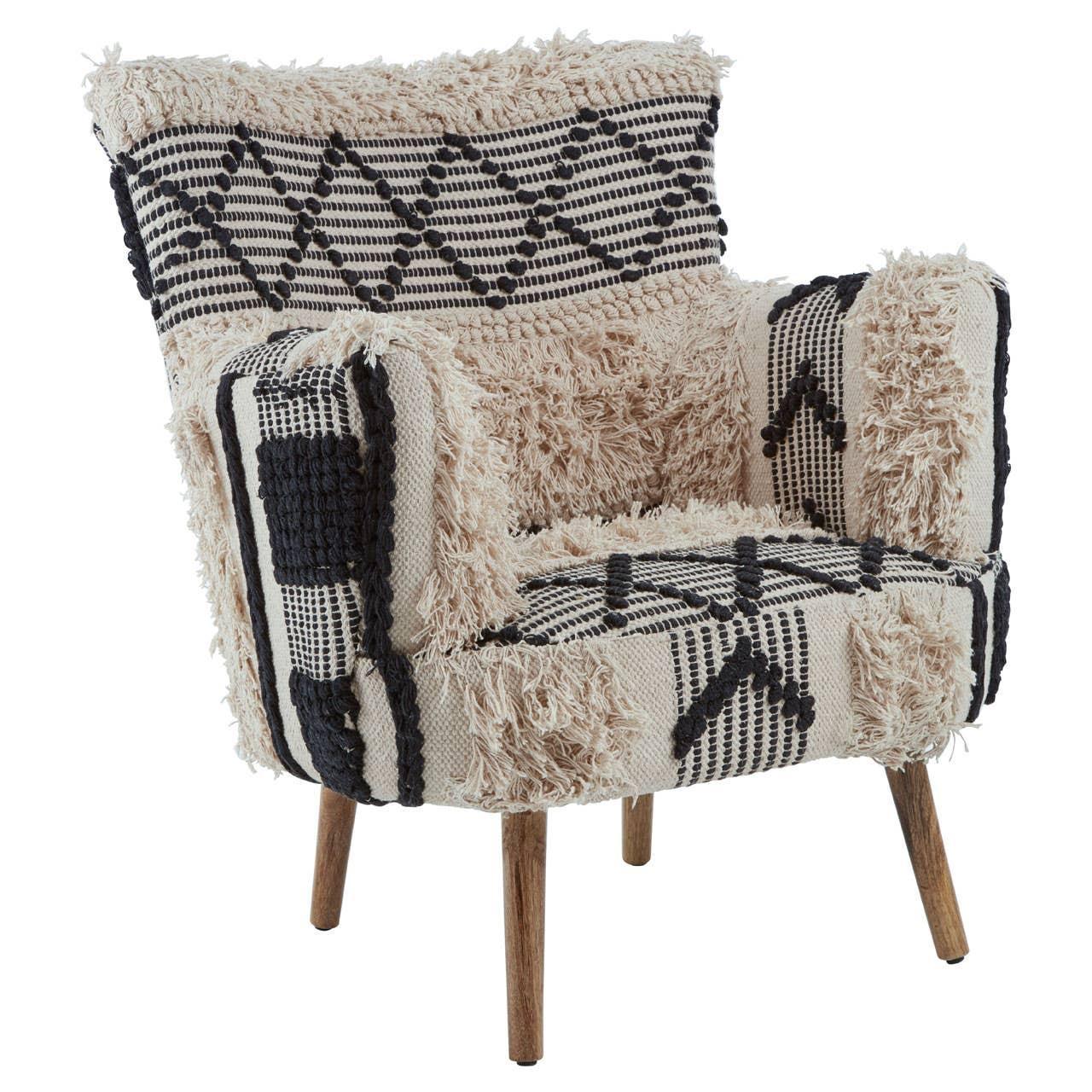 Textured accent armchair with cream and black geometric upholstery on wooden legs