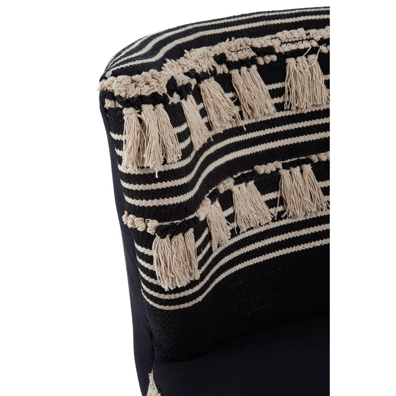 Black and beige striped upholstered armchair with fringe tassel detail
