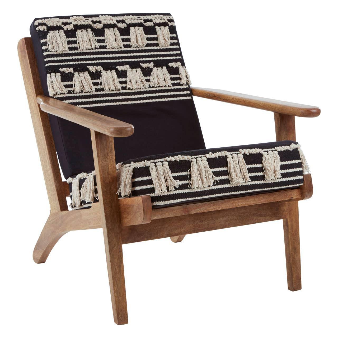 Wooden accent chair with black and cream striped cushions and decorative tassels