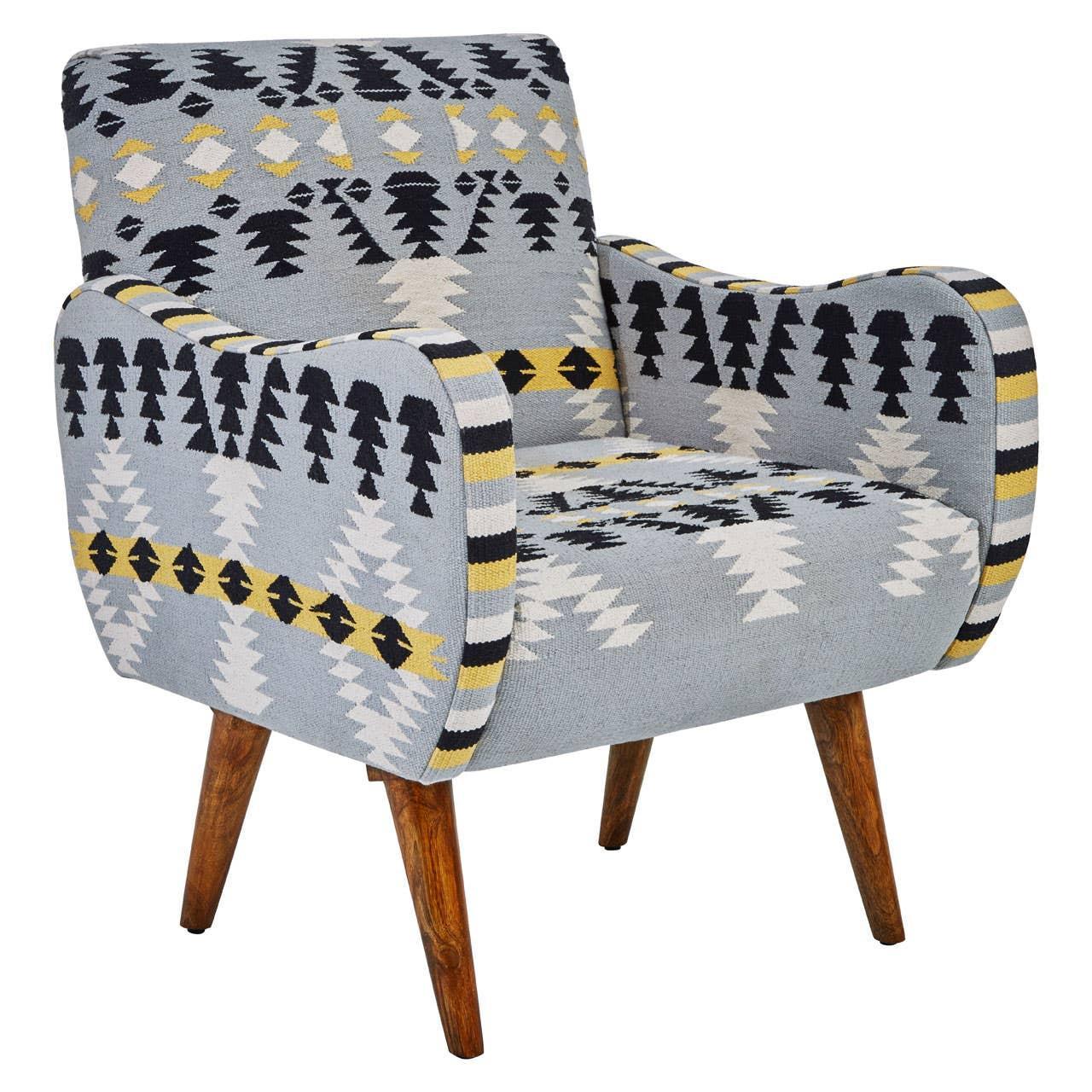 Patterned accent armchair with geometric upholstery and wooden legs, front angled view