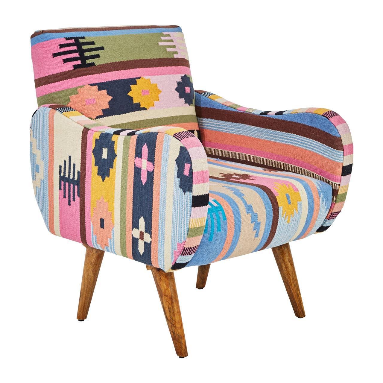 Patterned accent chair with colorful upholstery and wooden legs on a white background