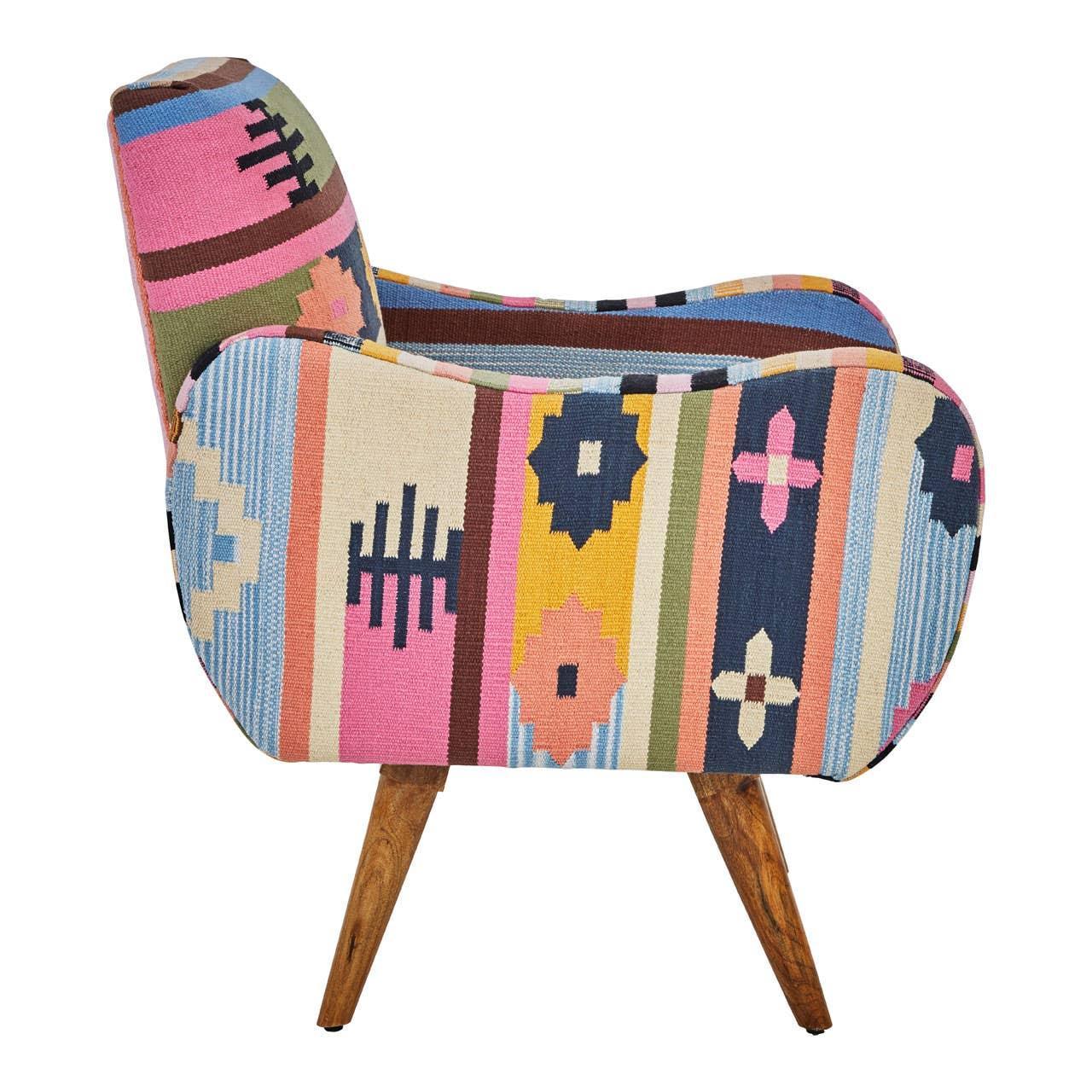 Side view of accent chair with multicolored geometric upholstery and wooden legs