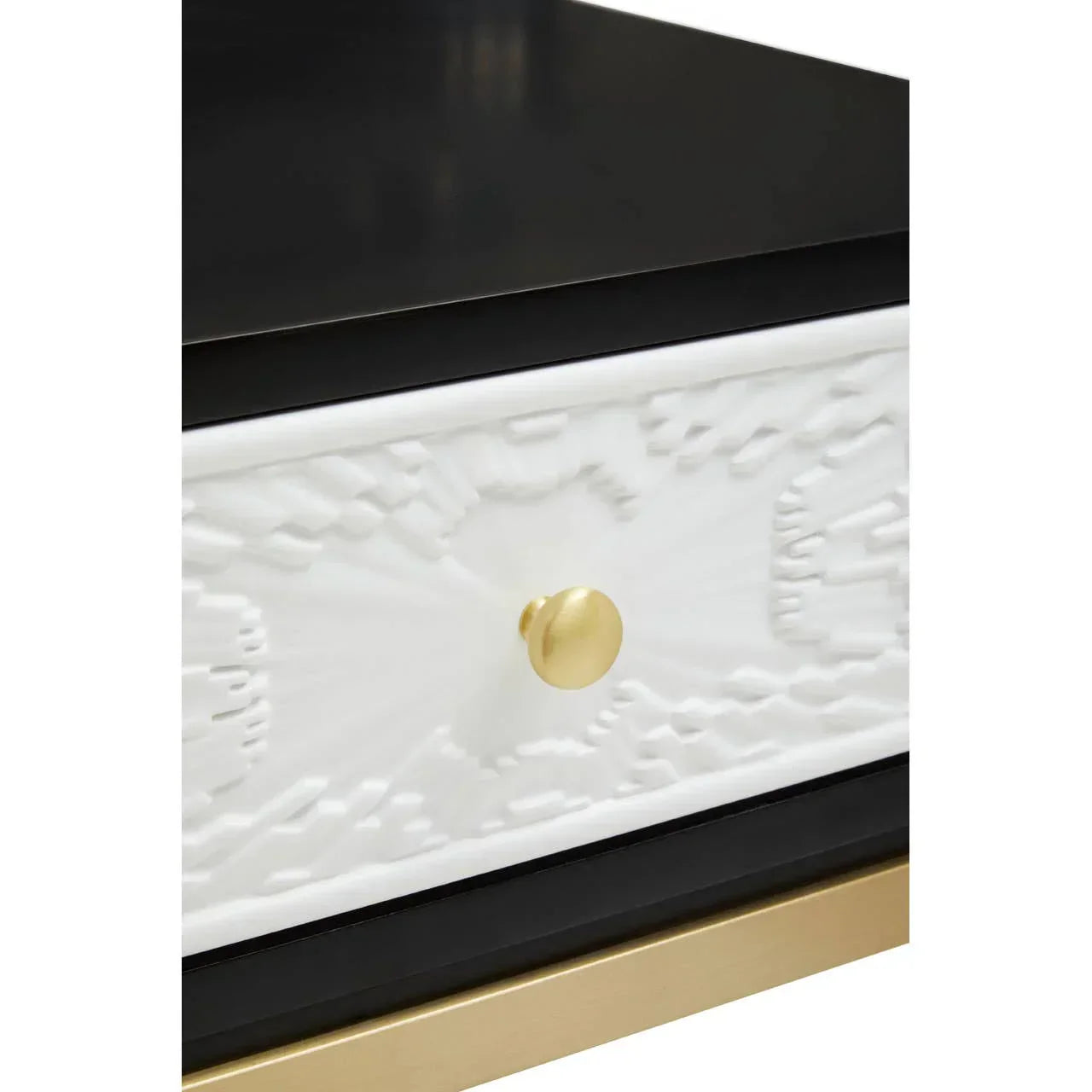 Black and white bedside table with gold drawer knob and embossed drawer front detail