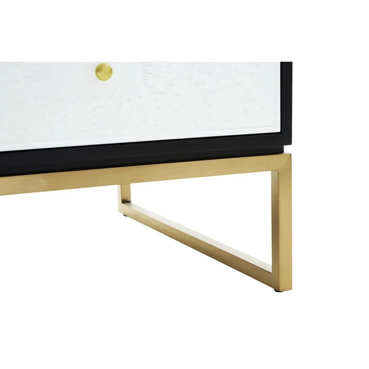 Gold metal furniture leg with black trim and white drawer detail