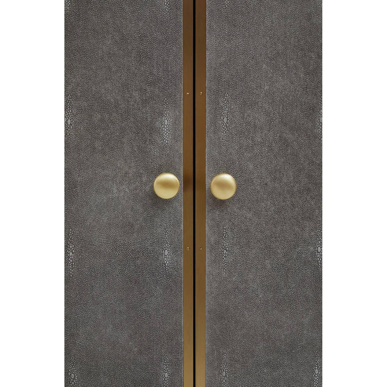 Textured cabinet doors with gold handles and central gold trim detail