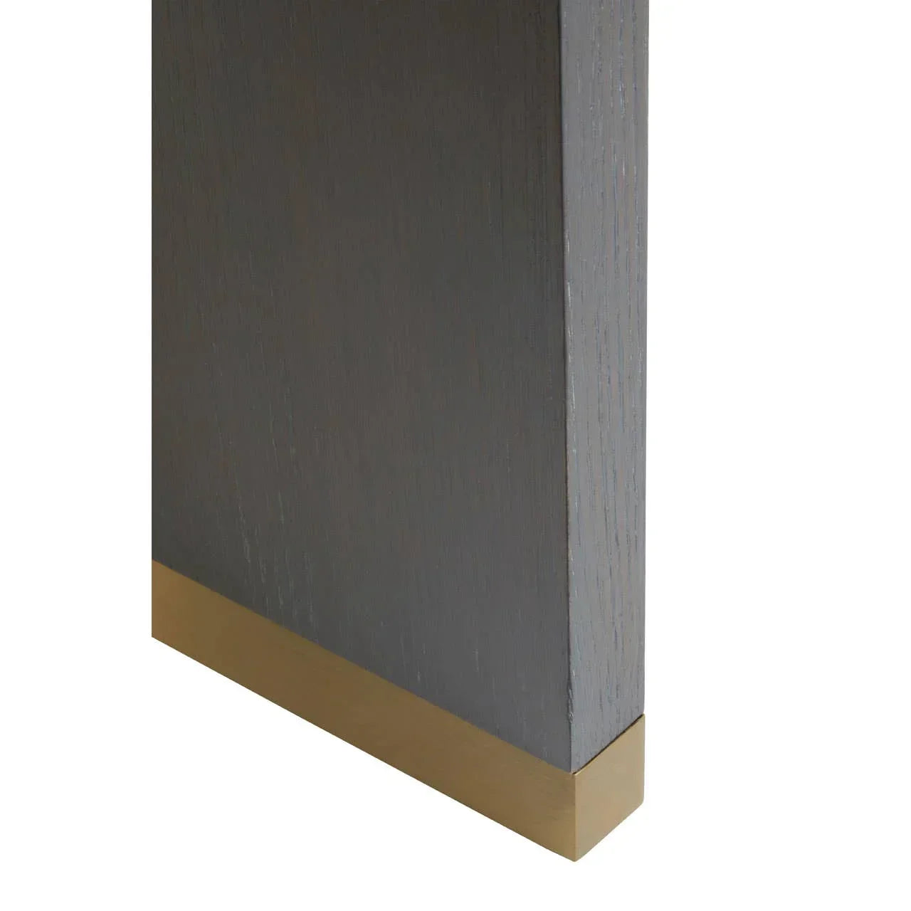 Dark wood furniture leg with gold metal trim detail