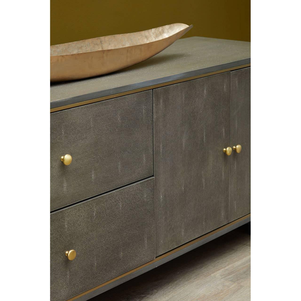 Grey sideboard with gold handles and decorative tray on top