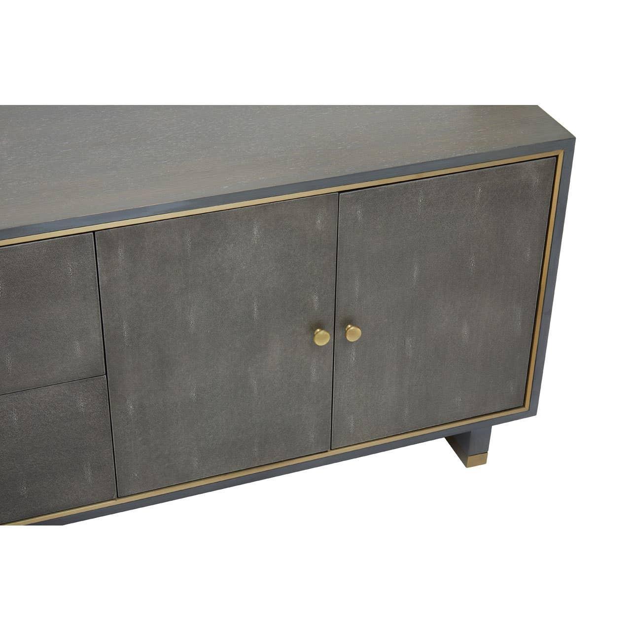 Grey sideboard cabinet with gold handles and trim, angled front view