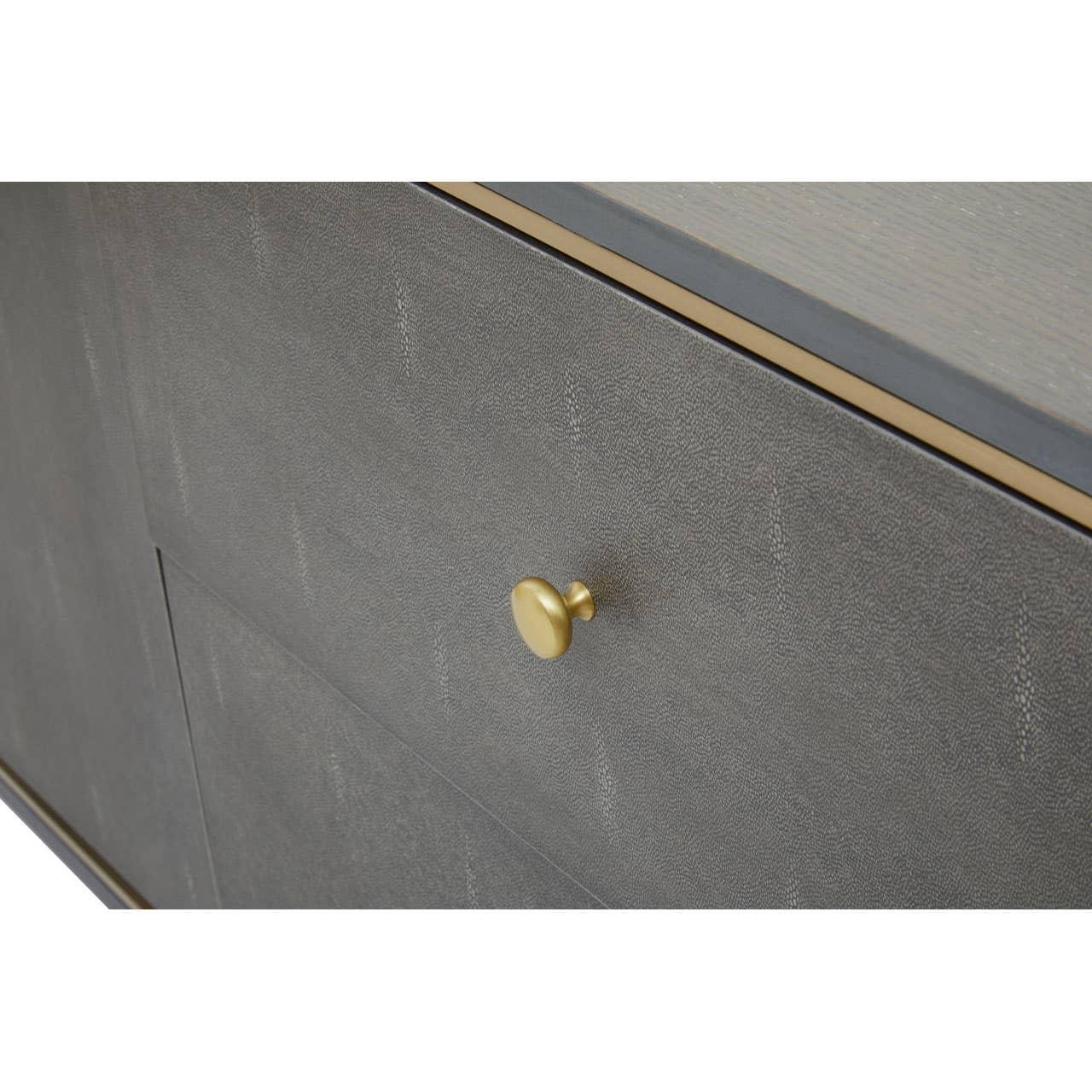 Close-up of grey cabinet drawer with textured finish and gold metal handle